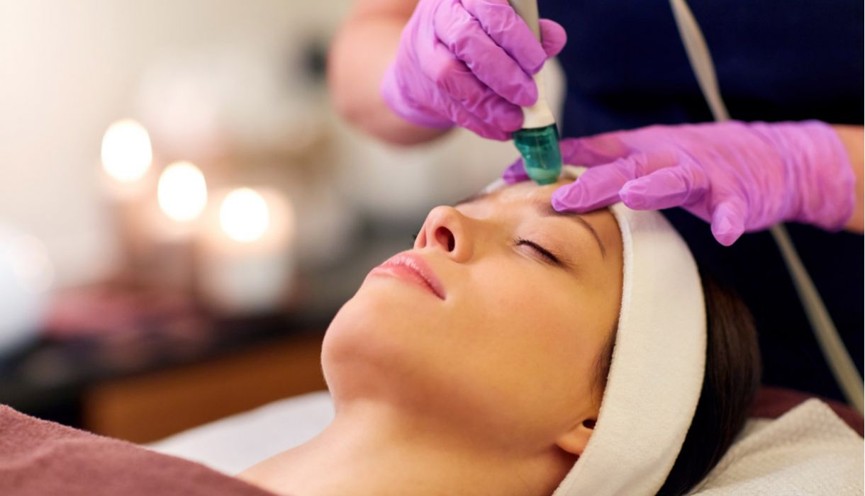 a woman receiving DiamondGlow skin resurfacing treatment