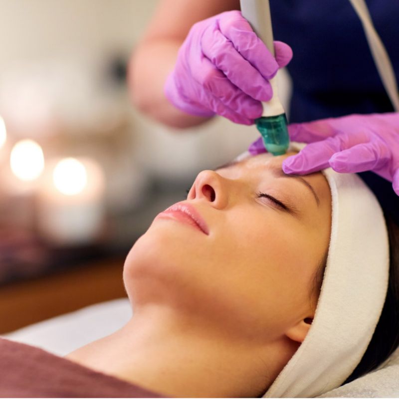 a woman receiving DiamondGlow skin resurfacing treatment