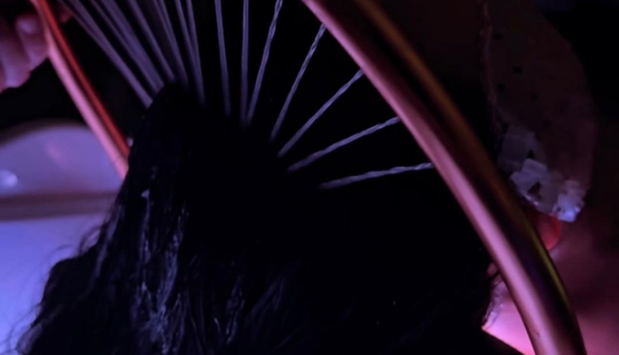 image of hair getting rinsed after a scalp treatment