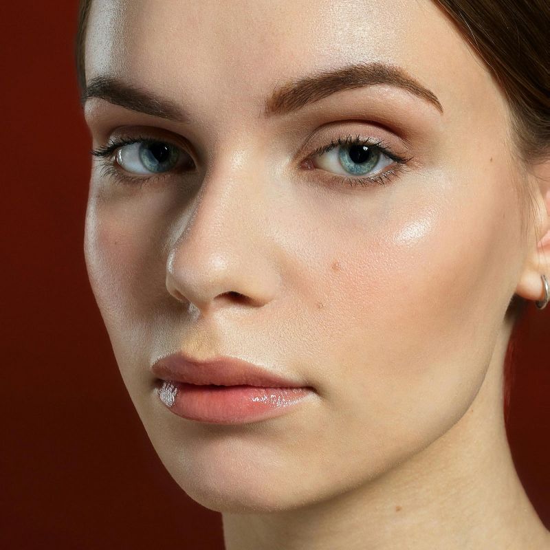 Woman with smooth clear skin after AquaGold treatment at Savage Serenity Med Spa